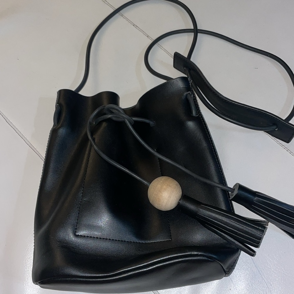 Black leather bucket crossbody drawstring bag